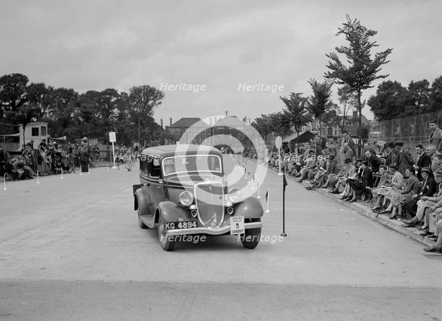 Ford V8 saloon of AE Harris competing in the South Wales Auto Club Welsh Rally, 1937 Artist: Bill Brunell.