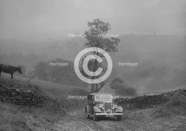 Ford V8 saloon of AKB Clarkson competing in the MCC Sporting Trial, 1935. Artist: Bill Brunell.