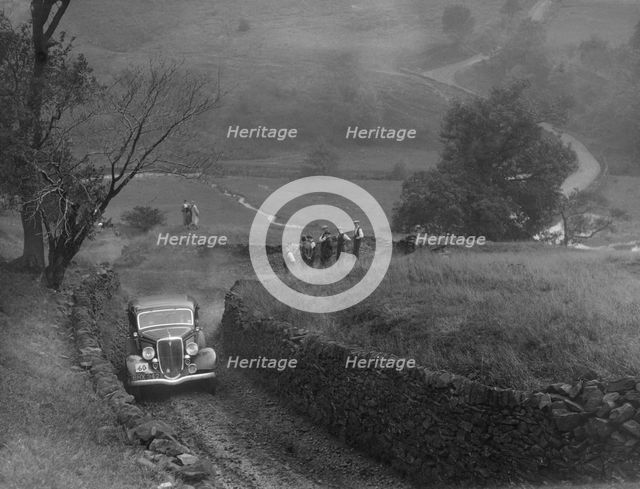 Ford V8 saloon of F Allott competing in the MCC Sporting Trial, 1935. Artist: Bill Brunell.