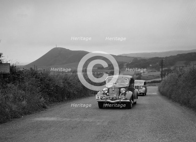 Ford V8 saloon of HJ Parsons competing in the South Wales Auto Club Welsh Rally, 1937 Artist: Bill Brunell.