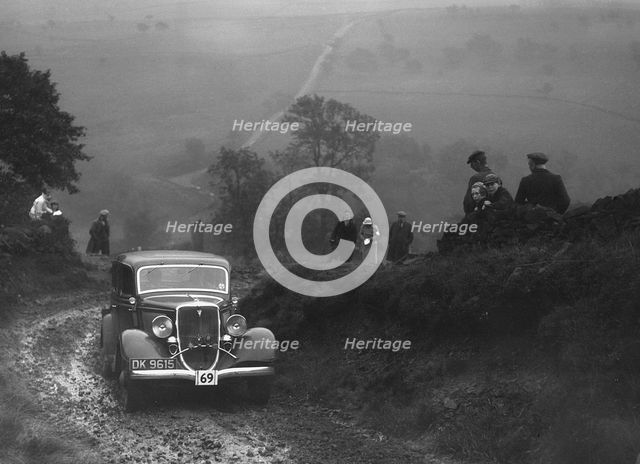 Ford V8 saloon of WT Platt competing in the MCC Sporting Trial, 1935. Artist: Bill Brunell.