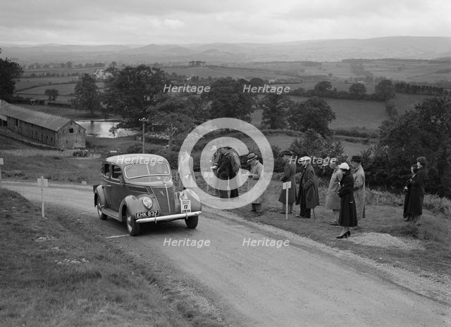 Ford V8 saloon of Viscountess Chetwynd competing in the South Wales Auto Club Welsh Rally, 1937 Artist: Bill Brunell.
