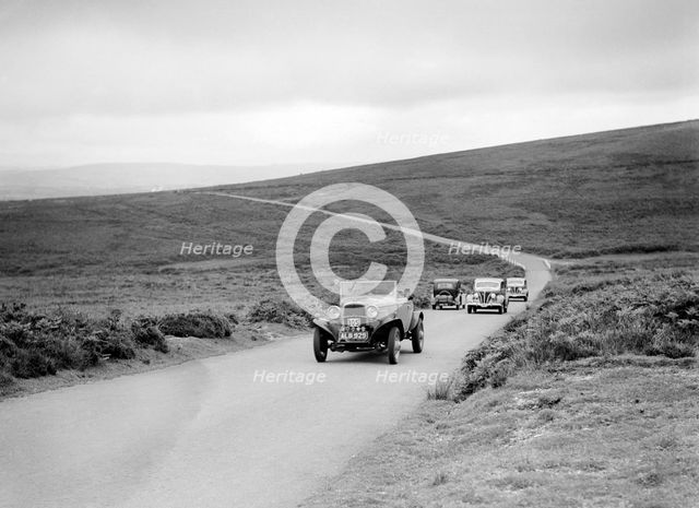 Ford V8s of WCN Norton and J Harrison competing at the MCC Torquay Rally, July 1937. Artist: Bill Brunell.