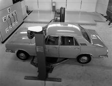 Ford Zodiac on an asymmetric lift, Sheffield, South Yorkshire, 1972. Creator: Michael Walters