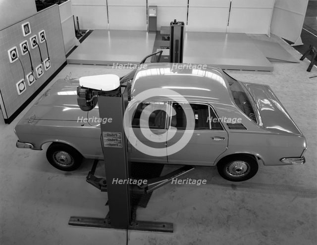 Ford Zodiac on an asymmetric lift, Sheffield, South Yorkshire, 1972.  Creator: Michael Walters.