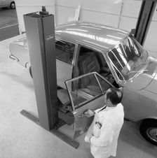 Ford Zodiac on an assymetric lift, Sheffield, South Yorkshire, 1972. Creator: Michael Walters