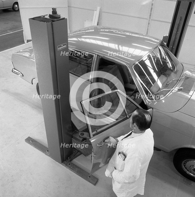 Ford Zodiac on an assymetric lift, Sheffield, South Yorkshire, 1972. Creator: Michael Walters.