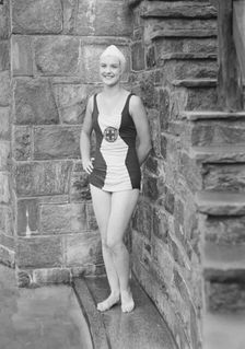 Ford, Elsie, Miss, standing outdoors in a bathing suit, 1932 July. Creator: Arnold Genthe