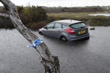 Ford Focus in flooded ditch after losing control on wet road 2012