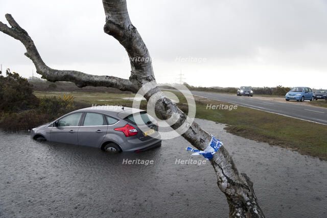 Ford Focus in flooded ditch after losing control on wet road 2012 Artist: Unknown.