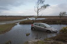 Ford Focus in flooded ditch after losing control on wet road 2012