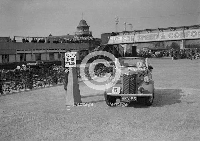 Ford Prefect tourer competing in the JCC Rally, Brooklands, Surrey, 1939. Artist: Bill Brunell.