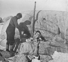 Forde Cooking Seal-Fry on the Blubber Stove at Cape Roberts c1911, (1913). Artist: Frank Debenham