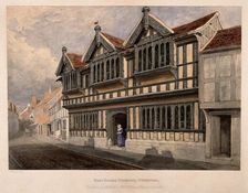 Ford's Hospital (Greyfriars Hospital), Coventry: a woman standing at the entrance, c1840s.. Creator: Edward Pretty