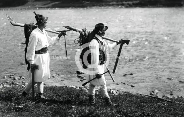 Foresters carrying their tools, Bistrita Valley, Moldavia, north-east Romania, c1920-c1945. Artist: Adolph Chevalier
