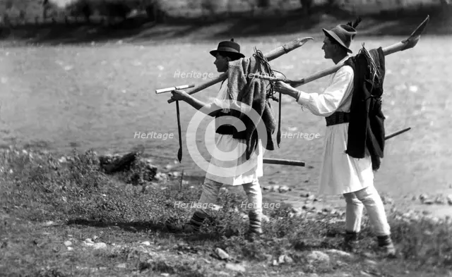 Foresters carrying their tools, Bistrita Valley, Moldavia, north-east Romania, c1920-c1945. Artist: Adolph Chevalier
