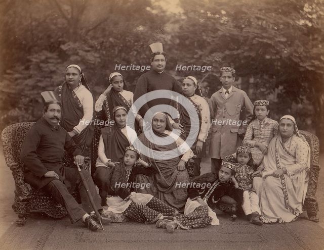 Formal Family Portrait of Thirteen People, Men in European Dress, 1860s-70s. Creator: Unknown.