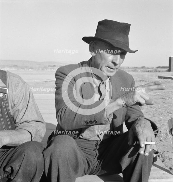 Former Nebraska Farmer, now a migrant farm worker, Klamath County, Oregon, 1939. Creator: Dorothea Lange.