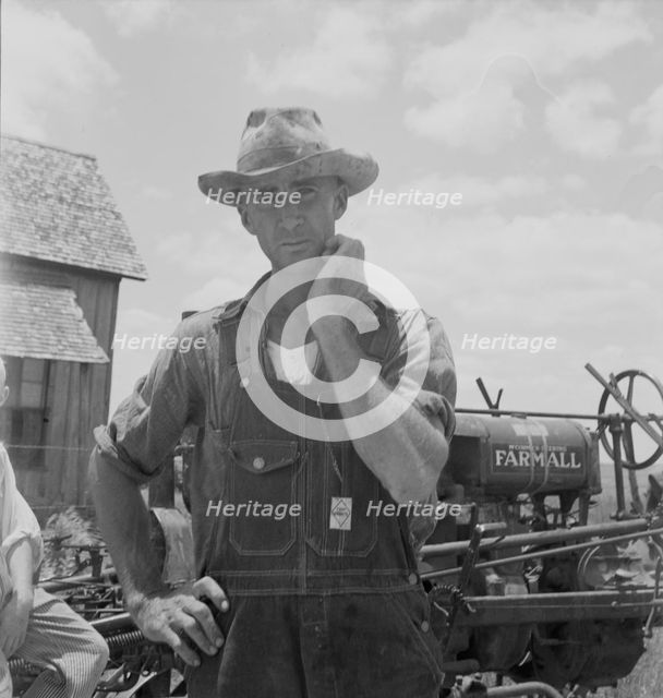 Former tenant farmer on a large cotton farm, now a tractor driver, Bell County, Texas, 1937. Creator: Dorothea Lange.