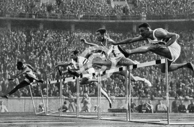 Forrest Towns, American Olympic champion in the 110 metres hurdles, 1936. Artist: Unknown