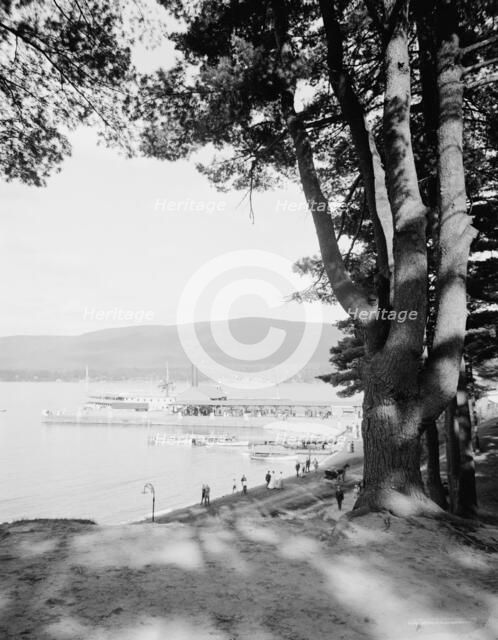 Fort William Henry Hotel, the old pine and the steamer landing, Lake George, N.Y., c1910-1920. Creator: Unknown.