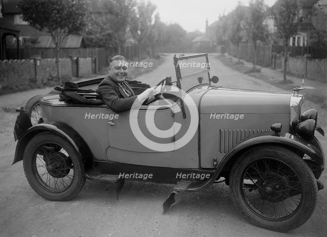 FA Thatcher behind the wheel of a 1929 Triumph Super Seven open four-seater. Artist: Bill Brunell.