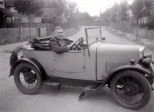 FA Thatcher behind the wheel of a 1929 Triumph Super Seven open four-seater. Artist: Bill Brunell