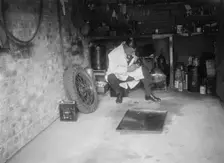 FA Thatcher in his garage. Artist: Bill Brunell
