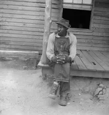 Father of sharecropper family, Person County, North Carolina, 1939. Creator: Dorothea Lange