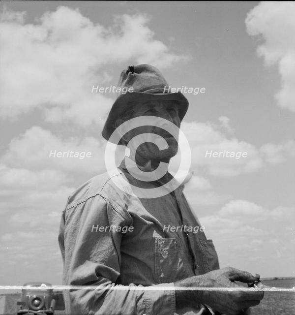 Father of Texas migrant family who follow the cotton crop from Corpus Christi..., 1937. Creator: Dorothea Lange.