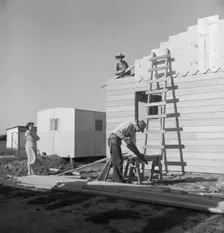 Father and son building house on outskirts of Salinas, California, 1939. Creator: Dorothea Lange