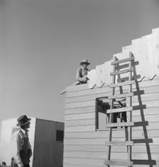 Father and son, recent migrants to California, building house, Salinas, California, 1939. Creator: Dorothea Lange