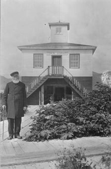 Father William Duncan, a missionary, in front of town library, between c1900 and 1923. Creator: Unknown