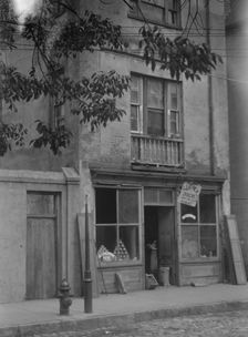 Facade of a grocery store, New Orleans or Charleston, South Carolina, between 1920 and 1926. Creator: Arnold Genthe