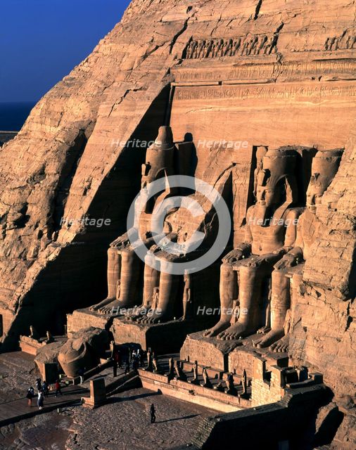 Façade of the Great Temple of Ramses II at Abu Simbel. It has four seated colossi of Ramses II an…
