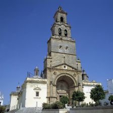 Façade and tower of the Church of Santa Maria de la Asunción in Utrera (Sevilla)
