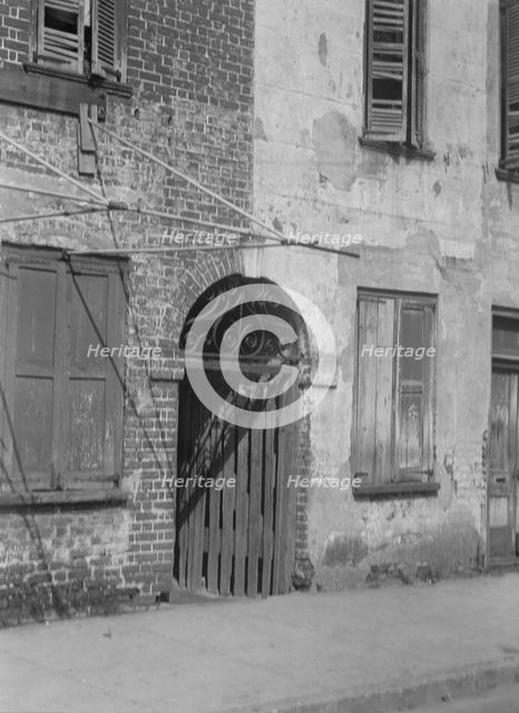 Facades of multi-story buildings, New Orleans or Charleston, South Carolina, between 1920 and 1926. Creator: Arnold Genthe.
