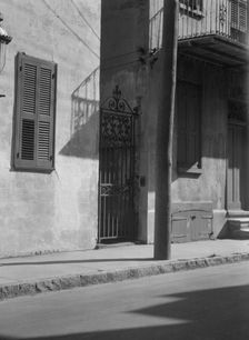 Facades of multi-story houses, New Orleans or Charleston, South Carolina, between 1920 and 1926. Creator: Arnold Genthe