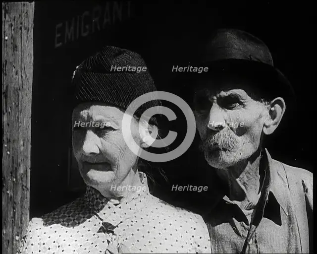 Faces of an Elderly Couple As They Watch a Train Arriving at a Station, 1932. Creator: British Pathe Ltd.