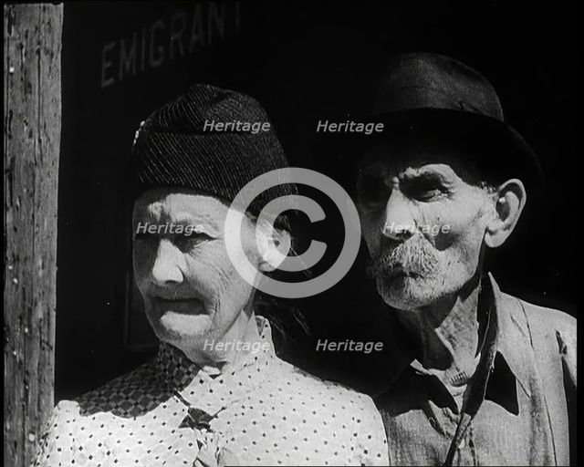 Faces of an Elderly Couple As They Watch a Train Arriving at a Station, 1932. Creator: British Pathe Ltd.