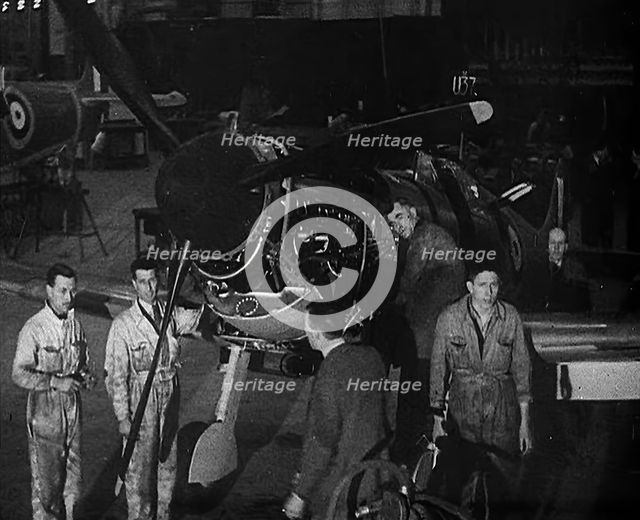 Factory Workers Inspecting a Spitfire Under Construction, 1940. Creator: British Pathe Ltd.