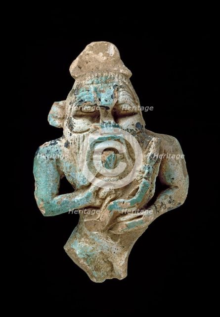 Faience amulet of Bes nursing a Horus, XXVth Dynasty (c770 BC-c715 BC). Artist: Unknown.