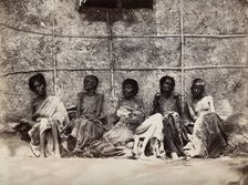 Famine in Mysore, India: six emaciated women, five sitting and one leaning on another's lap, 1876-78 Creator: Willoughby Wallace Hooper