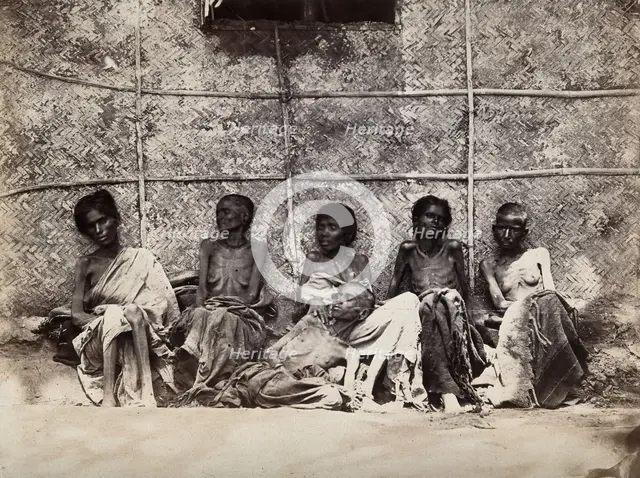Famine in Mysore, India: six emaciated women, five sitting and one leaning on another's lap, 1876-78 Creator: Willoughby Wallace Hooper.
