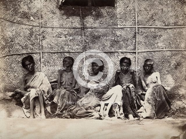 Famine in Mysore, India: six emaciated women, five sitting and one leaning on another's lap, 1876-78 Creator: Willoughby Wallace Hooper.
