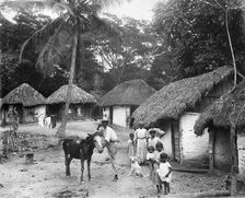 Family outside their home, Coolie Street, Kingston, Jamaica, 1931