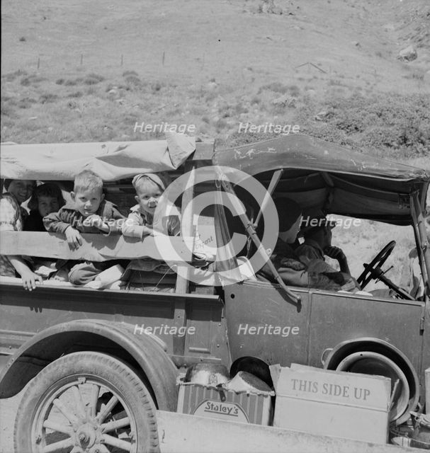 Family of drought refugees on US 99 near Bakersfield, California, 1937. Creator: Dorothea Lange.
