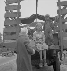 Family of ex-sharecroppers from Arkansas, near Little Rock, on California highway, 1937. Creator: Dorothea Lange