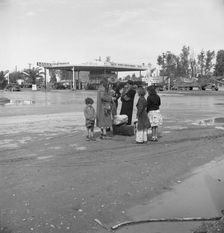 Family of homeless, walking people are left at the edge of the next town, 1939. Creator: Dorothea Lange