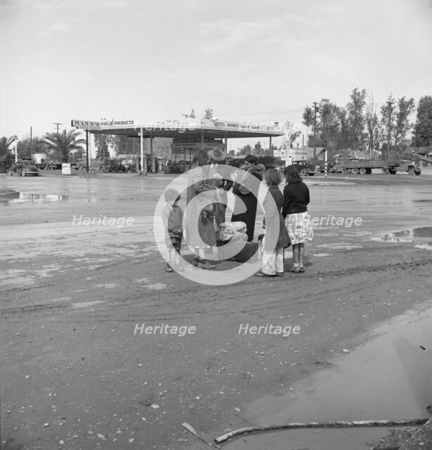 Family of homeless, walking people are left at the edge of the next town, 1939. Creator: Dorothea Lange.
